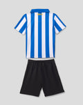 Back view of infant Sheffield Wednesday 2026/27 home kit showing blue and white vertical stripes and OWLS lettering at the neckline with black shorts
