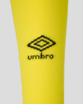 Close-up of bright yellow away sock showing the Umbro logo