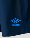 Navy training shorts fabric close up with bright blue Umbro logo on the leg.
