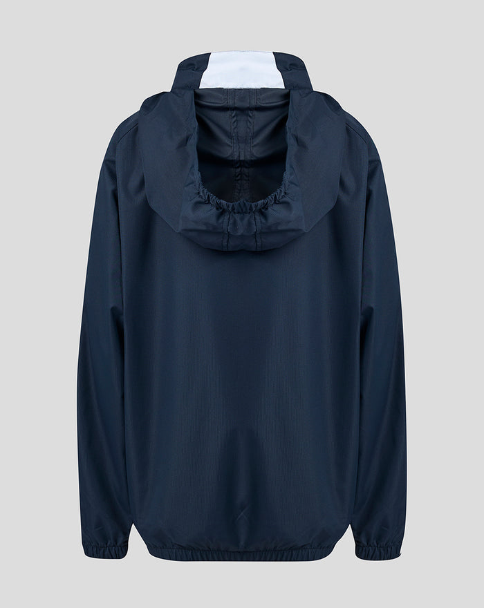 Back view of navy junior training showerproof jacket with attached hood and white inner hood panel