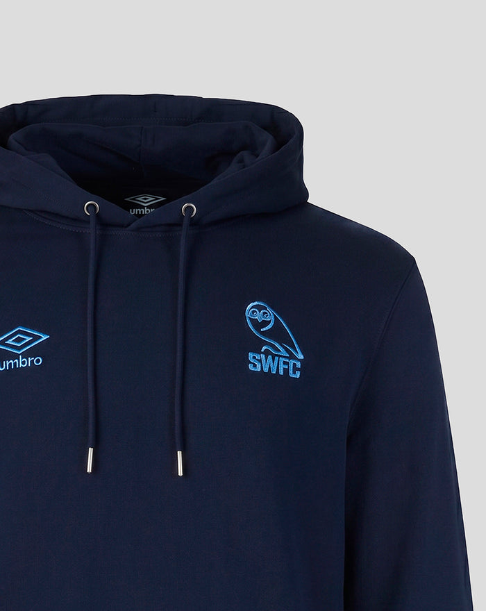 Navy hoodie chest close-up showing Umbro logo on left and SWFC crest on right in blue