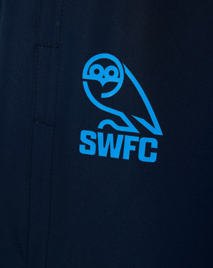 Close up of the blue SWFC logo on dark navy training pants