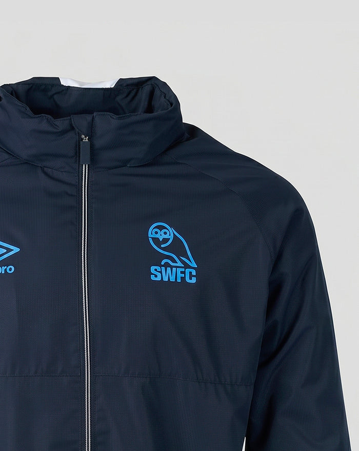 Navy Sheffield Wednesday training jacket close up with SWFC crest and blue Umbro logo on the chest.